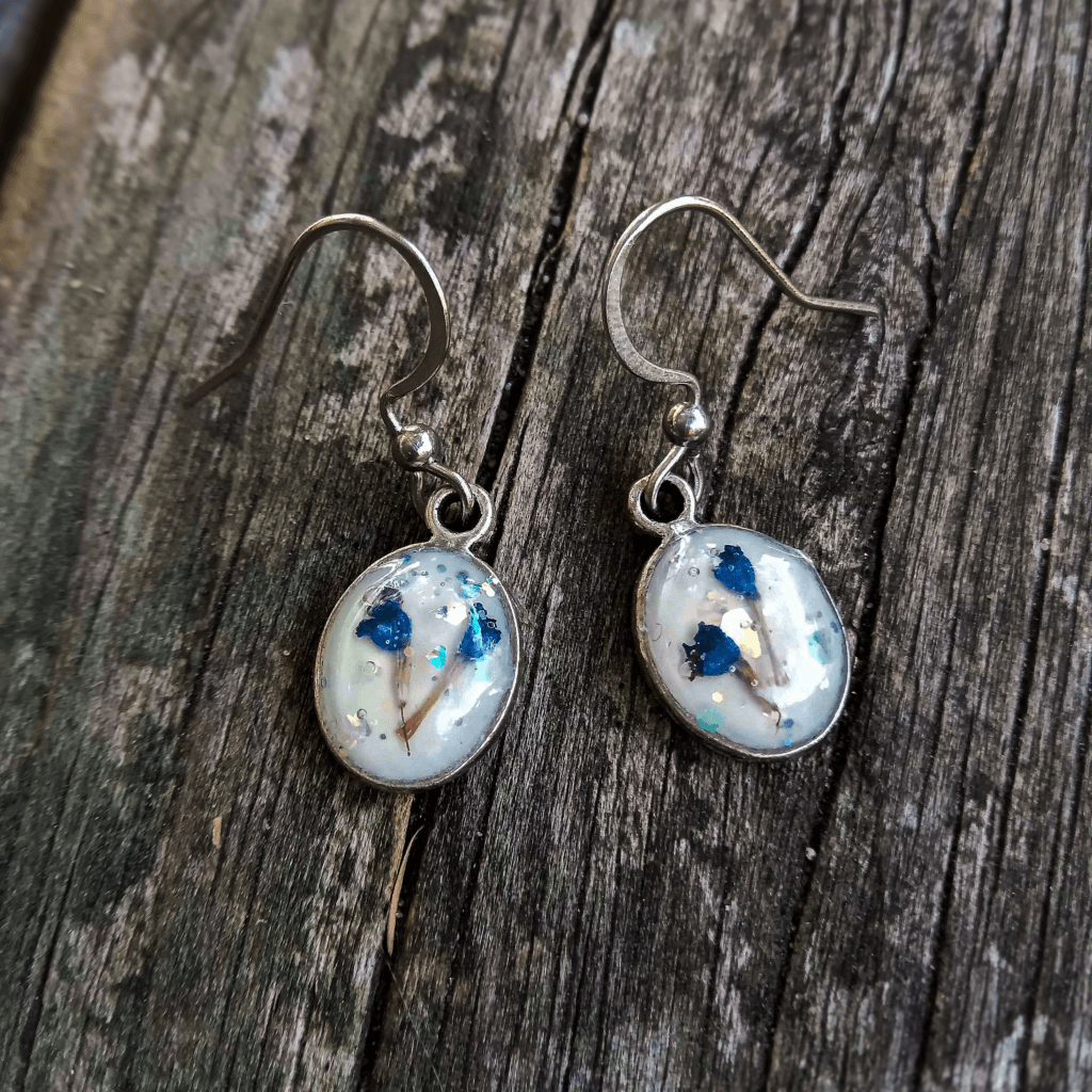 Lavender earrings encased in resin